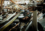 A body remains at the debris of an office in Shiraishi district of Otsuchi, Iwate, Japan.