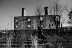 A man walks near the remains of the boiler building at the former complex site of the Unit 731 -- a covert biological and chemical warfare research and development unit of the Imperial Japanese Army that allegedly undertook lethal human experimentation during the Second Sino-Japanese War (1937–1945) and World War II. Harbin, China's North East.
