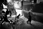 In Rocinha, members of ADA, or Amigos Dos Amigos, meaning Friends of Friends in English, stay in the alley during patrol to prevent the rival gangs and police from entering the community. May 2007.