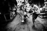 A pig is on the way of going to a meat market in Rocinha, the biggest favela in South America, where drug mafia, gangs, poverty and huge unemployment situation are extremely rampant. May 2007. 