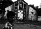 A boy walks through in front of a destroyed church in LTTE rebel’s stronghold of Kilinochchi, as the long civil war and the current fresh fighting have devastated many parts of Sri Lanka. Kilinochchi, Sri Lanka, June 13, 2006.