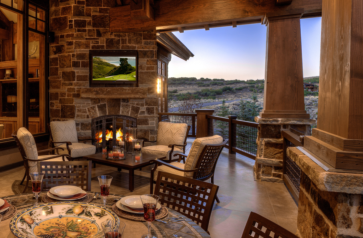 Exterior balcony dining area and view of landscape scenery. 