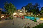 Exterior backyard pool, firepit and living area 