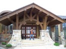 Exterior porte cochere with employee outside of construction