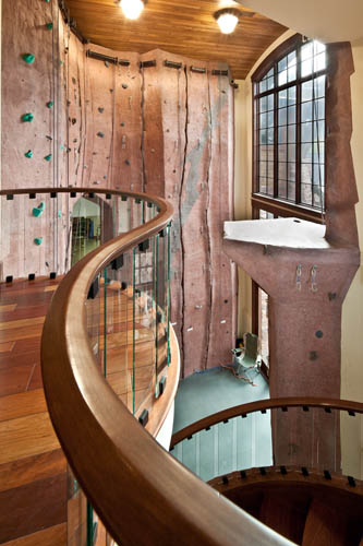 Interior upper level deck with view of indoor climbing wall