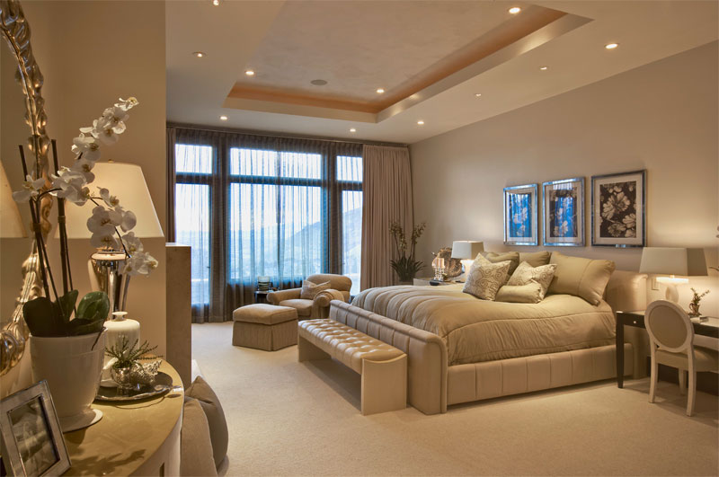 Interior upper level carpeted bedroom 