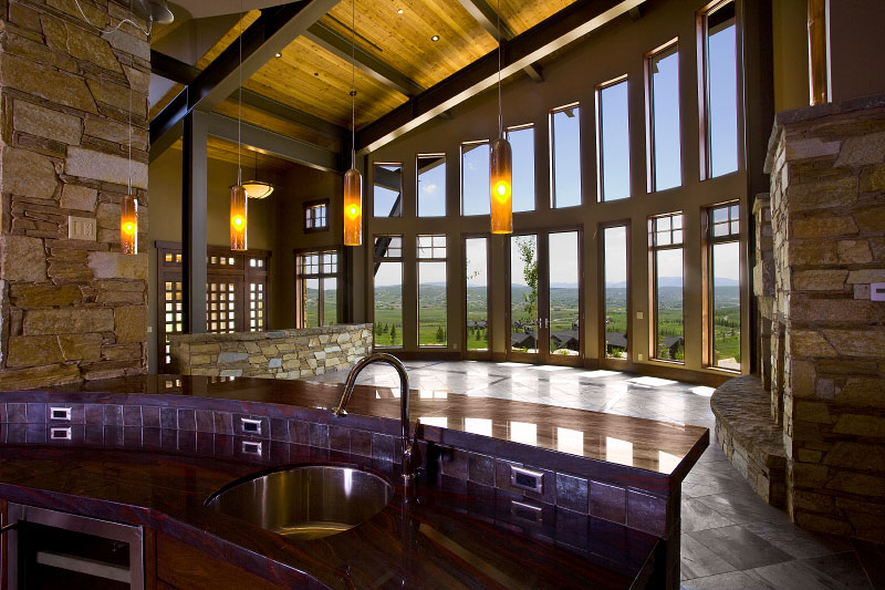 Interior upper level bar countertop with high glass curved windows 