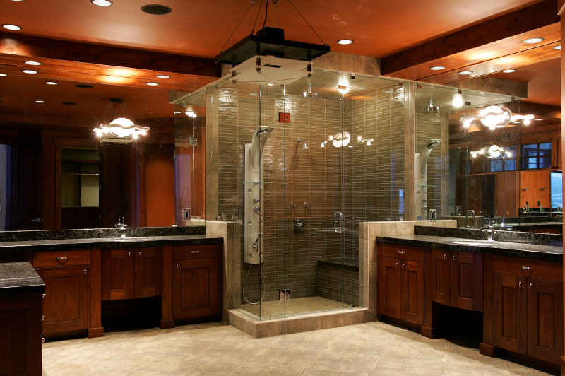 Interior master bathroom with glass shower, and matching dual sinks