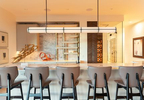 Interior lower level bar with white marble countertops