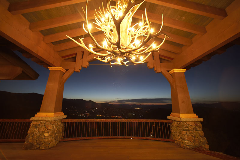 Exterior view of outside deck with antler chandalier 