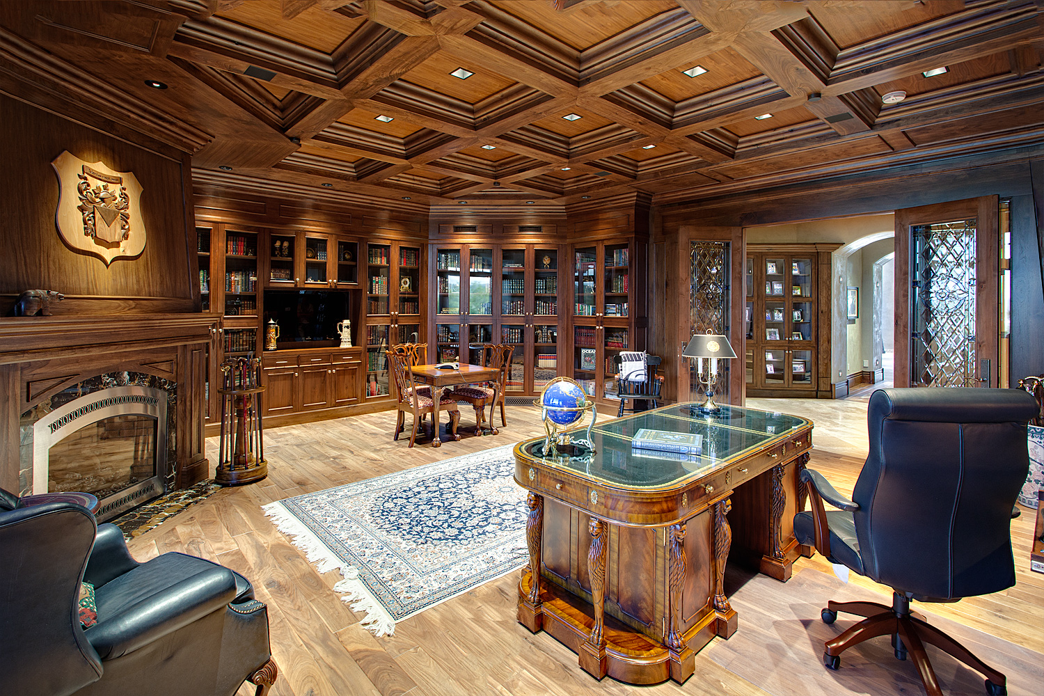 Interior home office with wooden shelving, flooring, and ceiling. 
