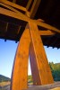 Exterior low angle view of wooden structual beams supporting the porte cochere