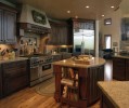 Interior kitchen with marble countertops wood flooring and wooden cabinets