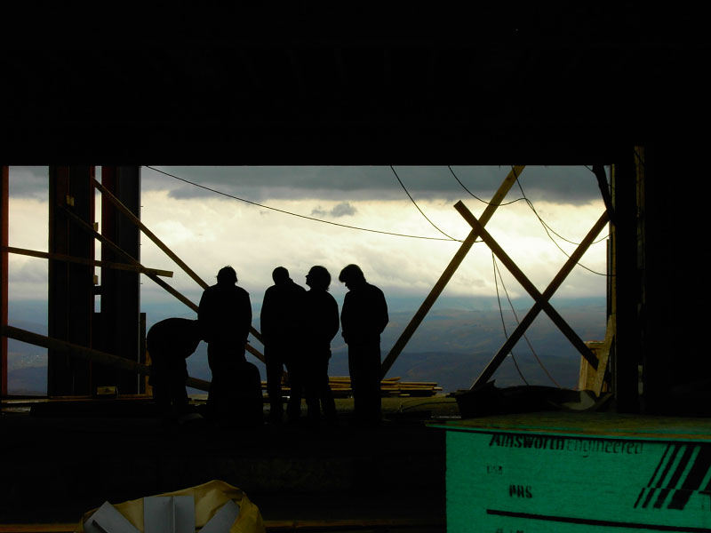 Architect silhouettes on site construction