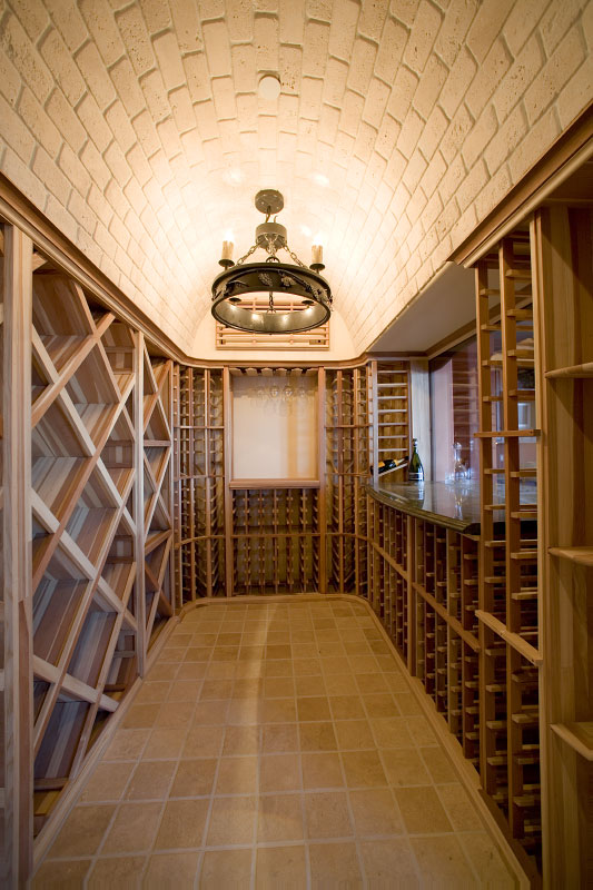 Interior view of wine room with high brick ceiling. 