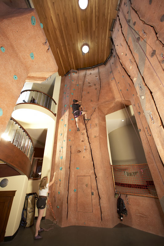 Interior lower level view of indoor climbing wall