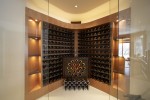 Interior wine room with wine rack and glass sliding doors 