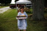Leslie Cooperband--co-owner of Prairie Fruits Farm carries tomatoes to the kitchen.