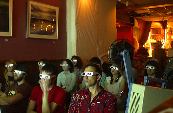 Members of an audience at Casa Cantina watch a 3-D movie during a special Casa Collections event on April 20, 2004. The night was a celebration of the {quote}holiday{quote} 4.20, which celebrates various ways of smoking marijuana and the experience of being high.