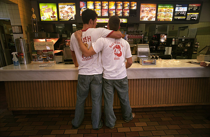 Jared Donnamiller and Steve Muetzel wait in line for their food at McDonalds during Kegs and Eggs, a party that follows a heavy night of drinking. 