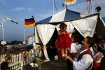 Carlo Gentile holds Giulia, 1, in front of the tent at The Zoppé family circus in Addison, Illinois.