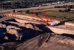 Aerial image of a Bucyrus Erie walking dragline excavating at the Winfield lignite coal strip mine near Interstate 30 and Mt. Pleasant, Texas. Bulldozers, in the foreground, move overbiurden. The mine and the Monticello Power Plant that it fed have now been closed.