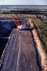 Aerial image of a Bucyrus Erie walking dragline excavating at the Winfield lignite coal strip mine near Interstate 30 and Mt. Pleasant, Texas. The mine and the Monticello Power Plant that it fed have now been closed.