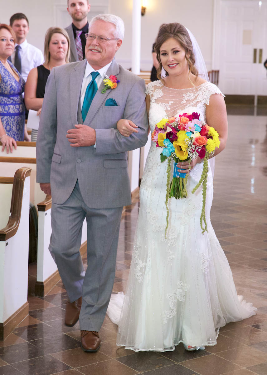 John and Alissa come down the aisle. Wedding pictures by Tiffany & Steve of Warmowski Photography. 