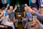 Ben starts the celebration with a toast in the party bus, Executive Transportation. Wedding pictures by Tiffany & Steve of Warmowski Photography.