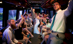 Back on the party bus for the final leg to Hamilton's 110 North East. Wedding pictures by Tiffany & Steve of Warmowski Photography.