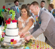 Alissa & Ben cut the cake, Icing on the Cake. Wedding pictures by Tiffany & Steve of Warmowski Photography.