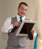 Best Man Sam reads a childhood letter to his brother. Wedding pictures by Tiffany & Steve of Warmowski Photography.