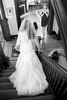 One of the bridesmaids reacts as Alissa comes down after putting on her wedding dress upstairs at the Old Rectory. Wedding ceremony held next door at Our Saviour Catholic Church in Jacksonville. Wedding photography by Tiffany & Steve Warmowski.