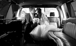Private moment in the limousine, Alissa & Brandon's wedding at Our Saviour Catholic Church, Jacksonville. Wedding photography by Tiffany & Steve Warmowski.