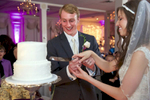 Cake cutting, Alissa & Brandon's wedding reception at Hamilton's 110 North East. Wedding photography by Tiffany & Steve Warmowski.