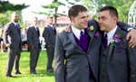 Best Man Clay hugs Nick after getting emotional before the wedding ceremony at the Jacksonville Illinois Country Club. Wedding photography by Steve & Tiffany Warmowski.