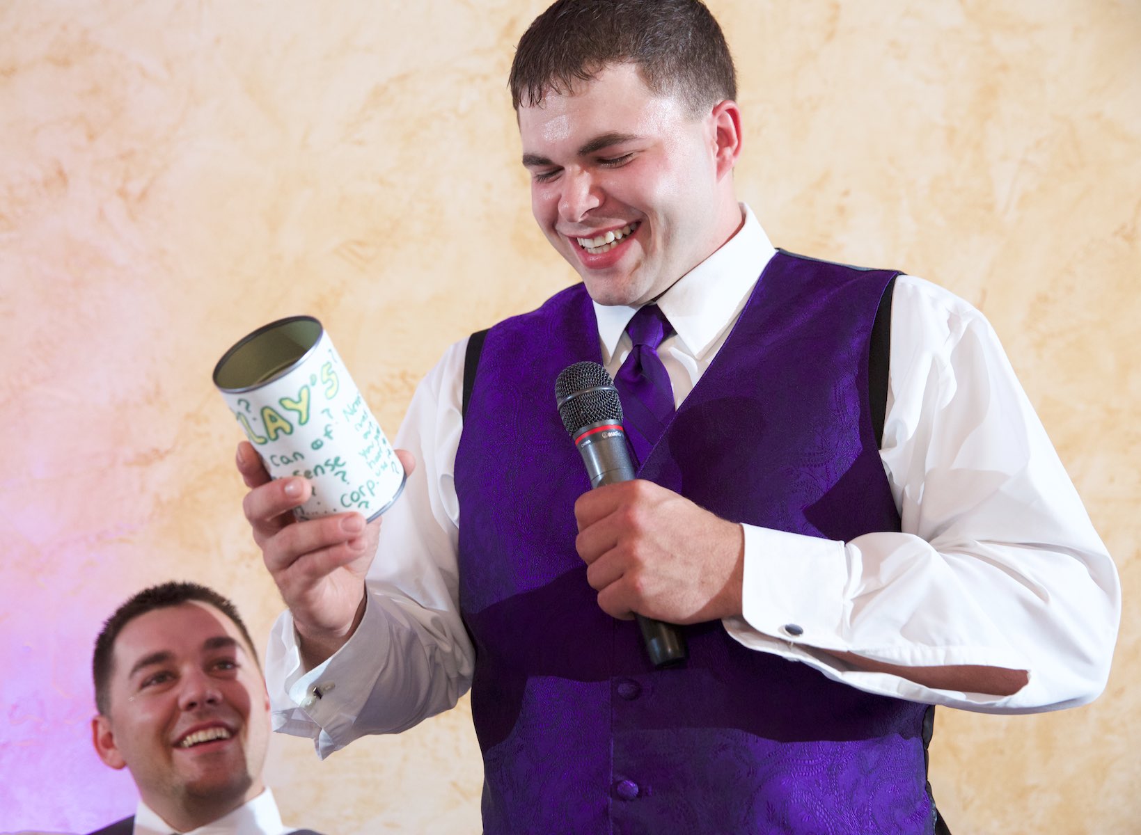 Best Man Clay brings out a {quote}can of common sense{quote} Nick gave to him back in high school during toasts, wedding reception at the Jacksonville Illinois Country Club. Wedding photography by Steve & Tiffany Warmowski.