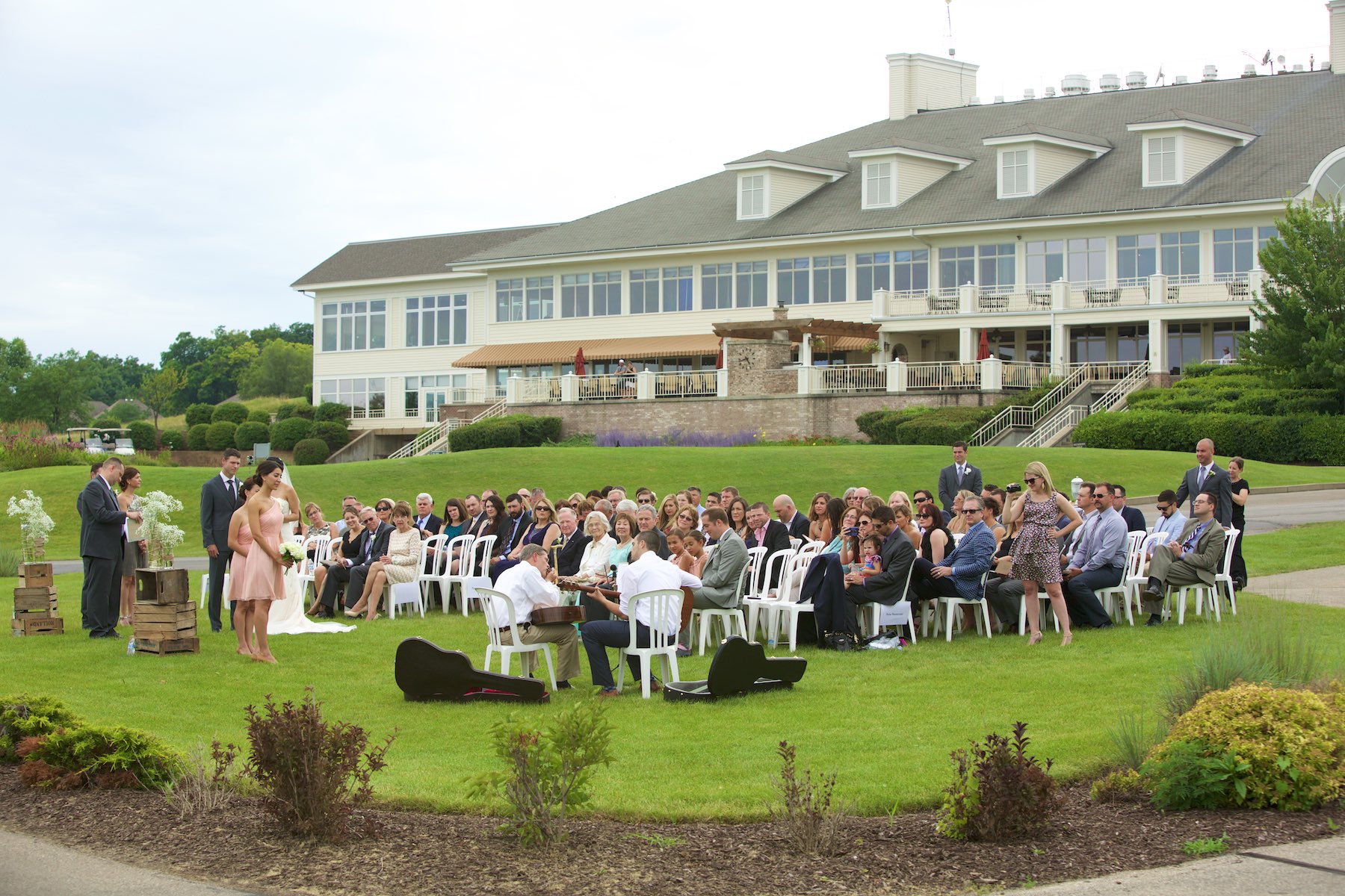 Scene setter, Emi & Daniel's wedding ceremony at Geneva National Golf Club in Lake Geneva, Wisconsin. Wedding photography by Steve & Tiffany Warmowski.