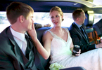 Jaclyn sings to Scott as the wedding party enjoys the limousine on the trip to the iHotel in Champaign for the wedding reception. Wedding photography by Tiffany & Steve of Warmowski Photography.