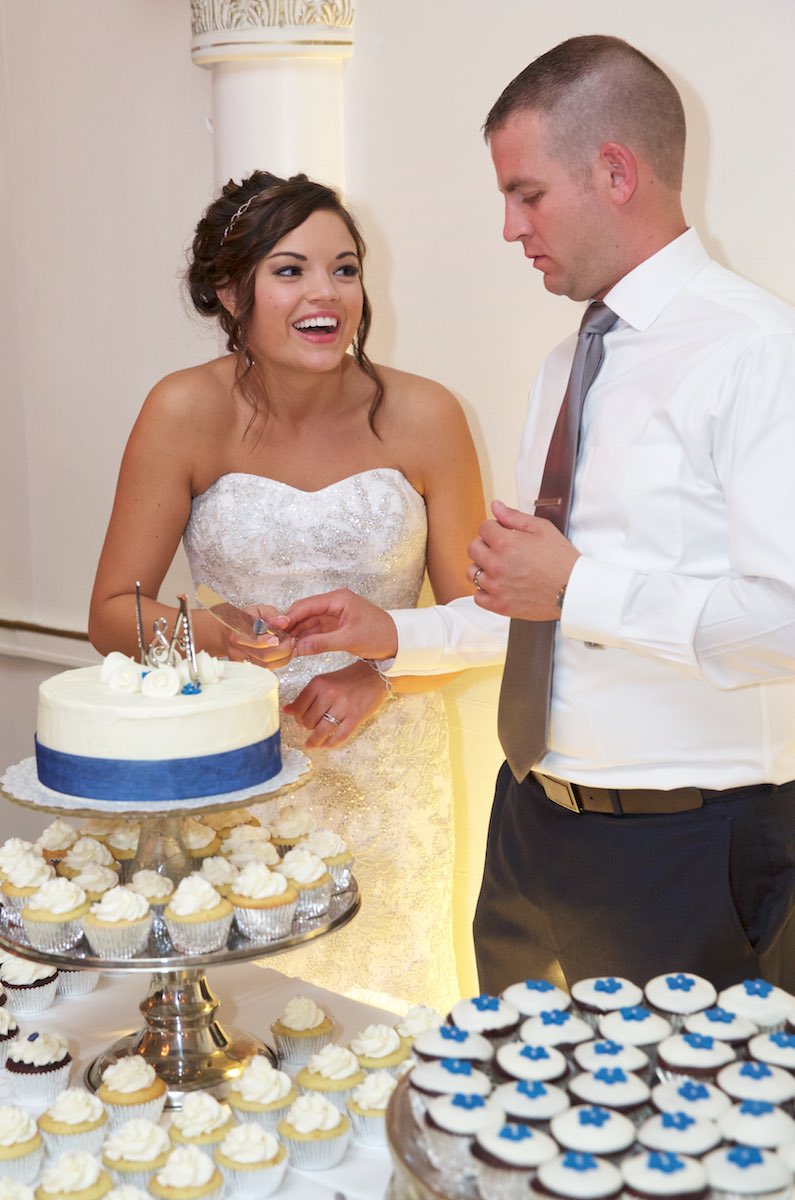 Adria & Jeremy cut their wedding cake, wedding reception at Hamilton's 110 North East, Jacksonville, Illinois. Wedding photography by Steve & Tiffany Warmowski.