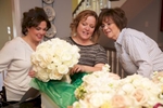 Elizabeth and her mother check out bouquets with Sass & Class Flowers florist at their home. Wedding photography by Steve & Tiffany Warmowski