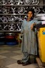 Young mechanic in a tire shop behind Super Market, Islamabad