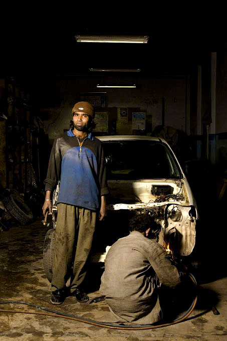 Metal workers in their shop behind Super Market area, Islamabad