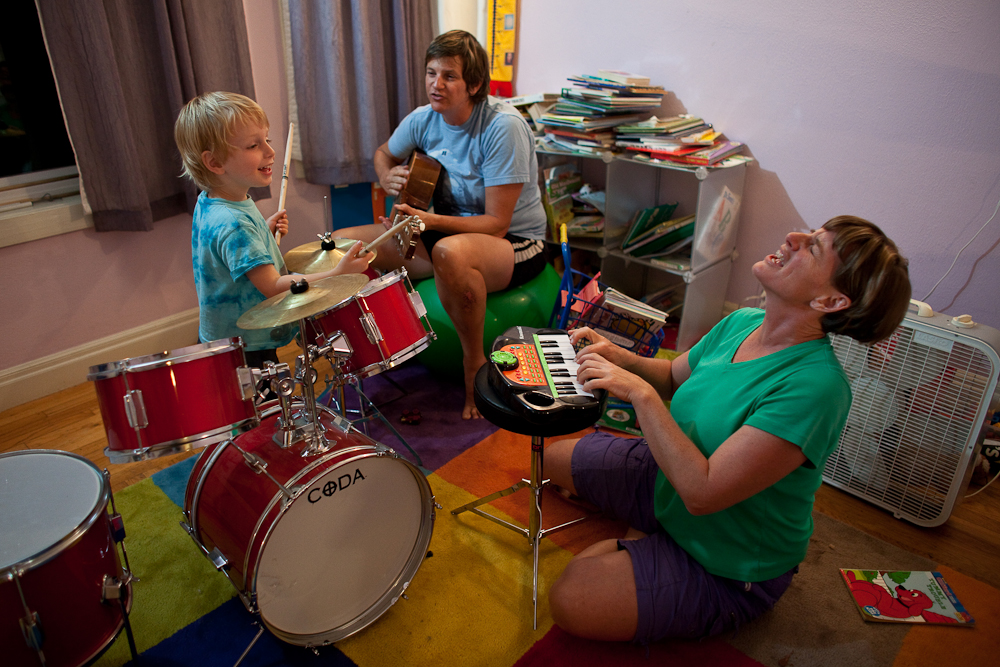 Lois Bukowski (C) and Katie Baer (R) play music with their son, Wade Baer-Bukowski, 3 at home in Oakland, California.