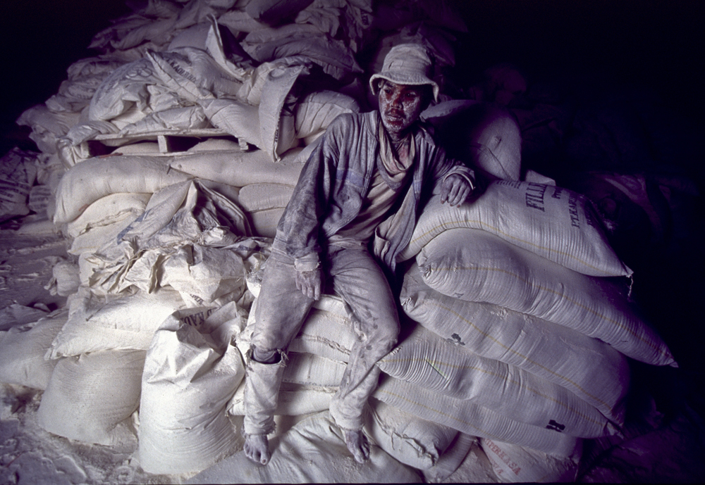 A worker in a flour mill in Jakarta, Indonesia takes a break.