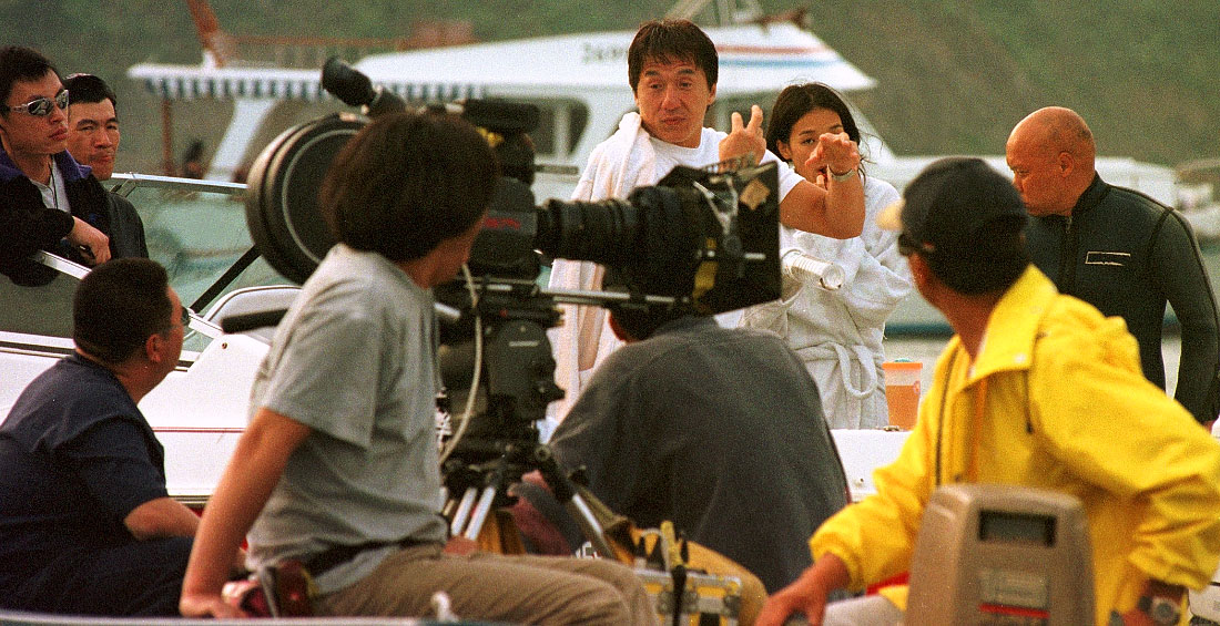 Jackie Chan goes through some ideas for a scene with the film crew on location in Sai Kung, Hong Kong
