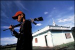 A young guard of the Abu Sayyaf watches over his mosque on the muslim island of Mindanao, Philippines.