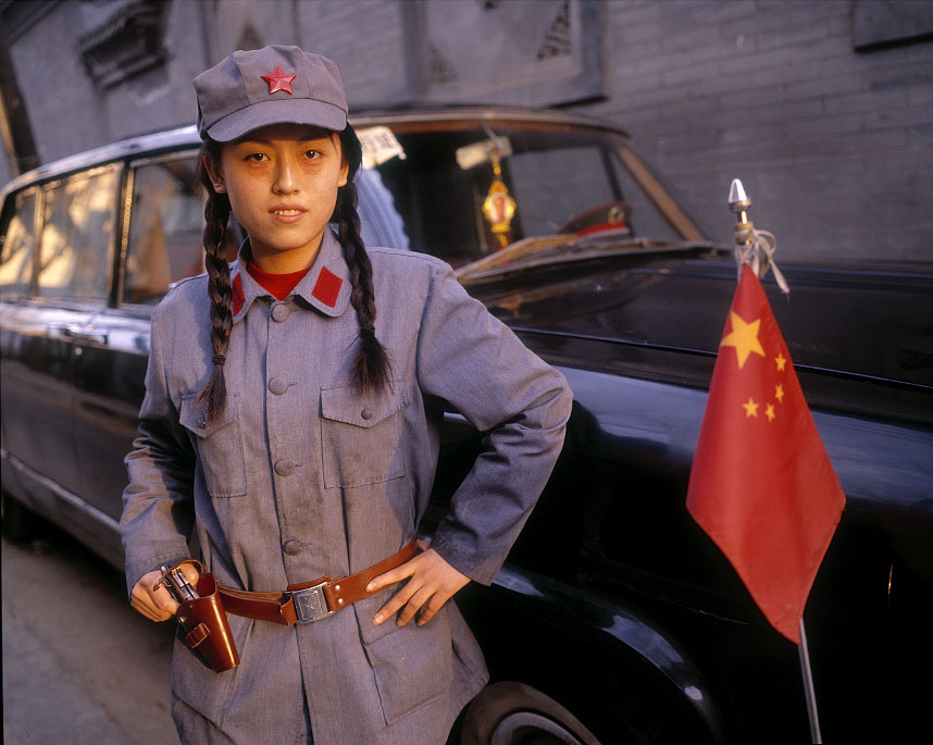 A young girl poses in a PLA uniform in Beijing, China.