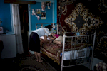 June 04, 2013: MYASNIKYAN, ARMENIA- Anoush Gasparyan watches her five year old sleeping daughter Anahid in their home in the village of Myasnikyan.  The family, which is struggling after a series of accidents and health issues including snake bite and lightning strikes,  receives help from the diaspora-based Children of Armenia Fund (COAF).  COAF was founded by Istanbul-born, American-based Armenian Dr. Garo Armen, who was struck by the depths of poverty in the Aramir region of Armenia and resolved to do something about it.  The organization, which is largely supported by Diasporan Armenians, mostly funds schools, but also assists in providing a more comprehensive social care to the families of the village children. Photo by Scout Tufankjian/Polaris
