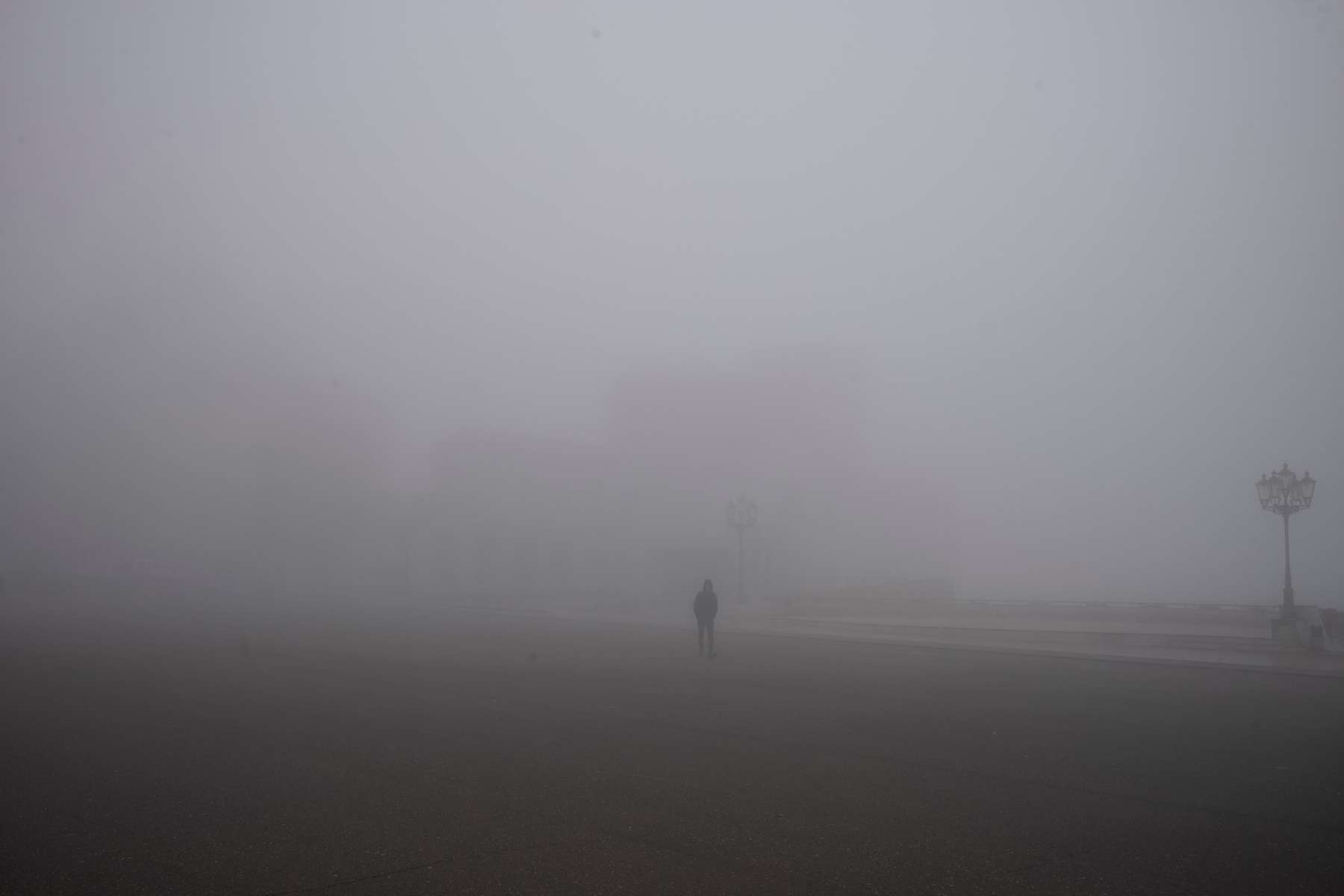 A young man walks through the main square of Nagorno Karabakh’s capital city to meet one of the busloads of returning Armenian families who had been been displaced by the war.  People often talk about the fog of war, but the fog of the aftermath is just as pervasive. It engulfs the moment and spreads outward, blurring the edges so that the past is obscured, the future impossible. As busloads of displaced families make their way back to Karabakh, the weather seems complicit with the uncertainty that hangs heavy in the air. The city of Stepanakert is enveloped in a fog so thick, returnees have no idea what they are returning to.